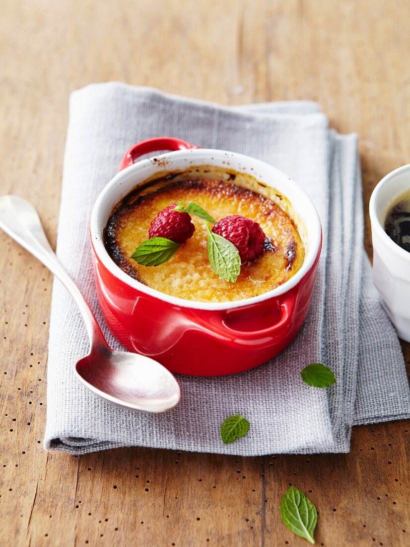 Almond baked egg custard casserole with raspberries and mint