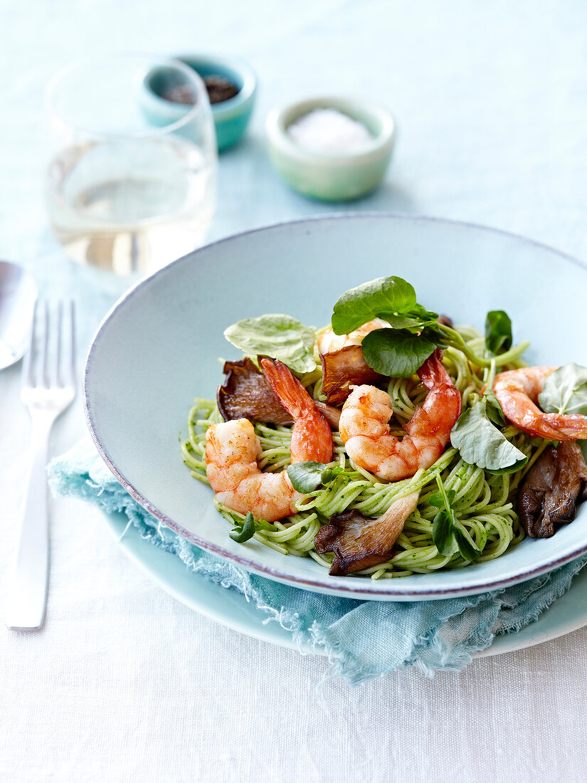 Spaghettis in green sauce,pleurotus mushrooms and shrimps