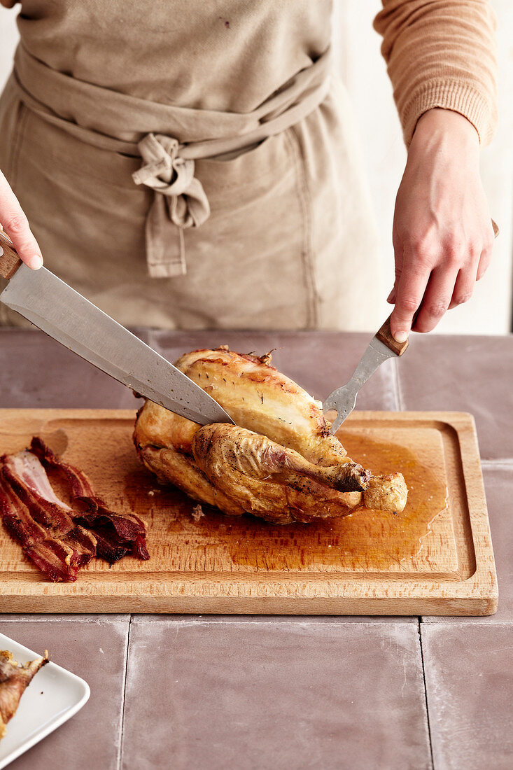 Carving a poultry: removing the bacon and string