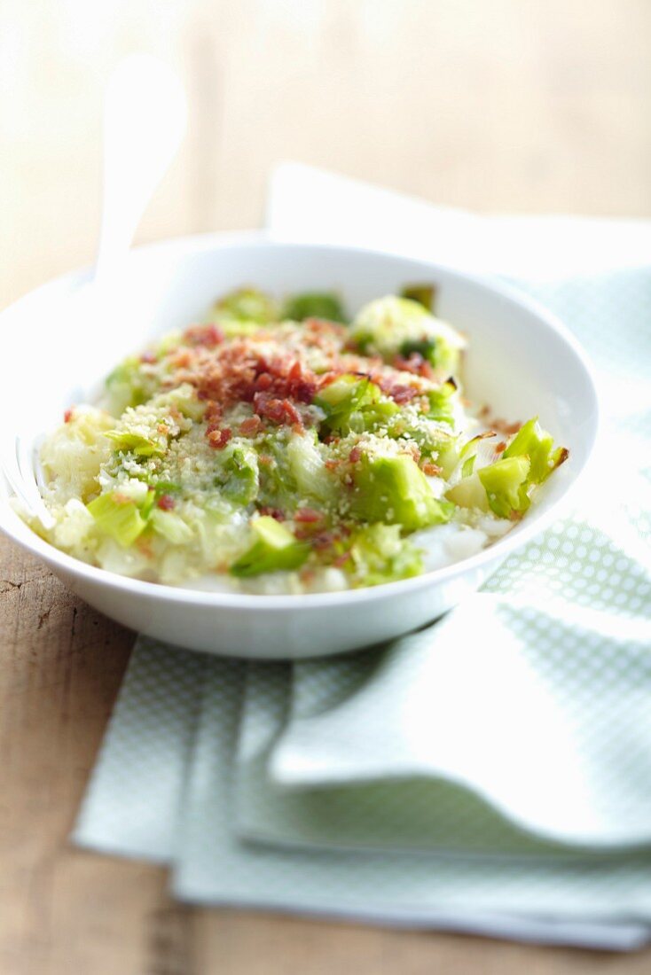 Chopped leeks with thinly sliced raw ham
