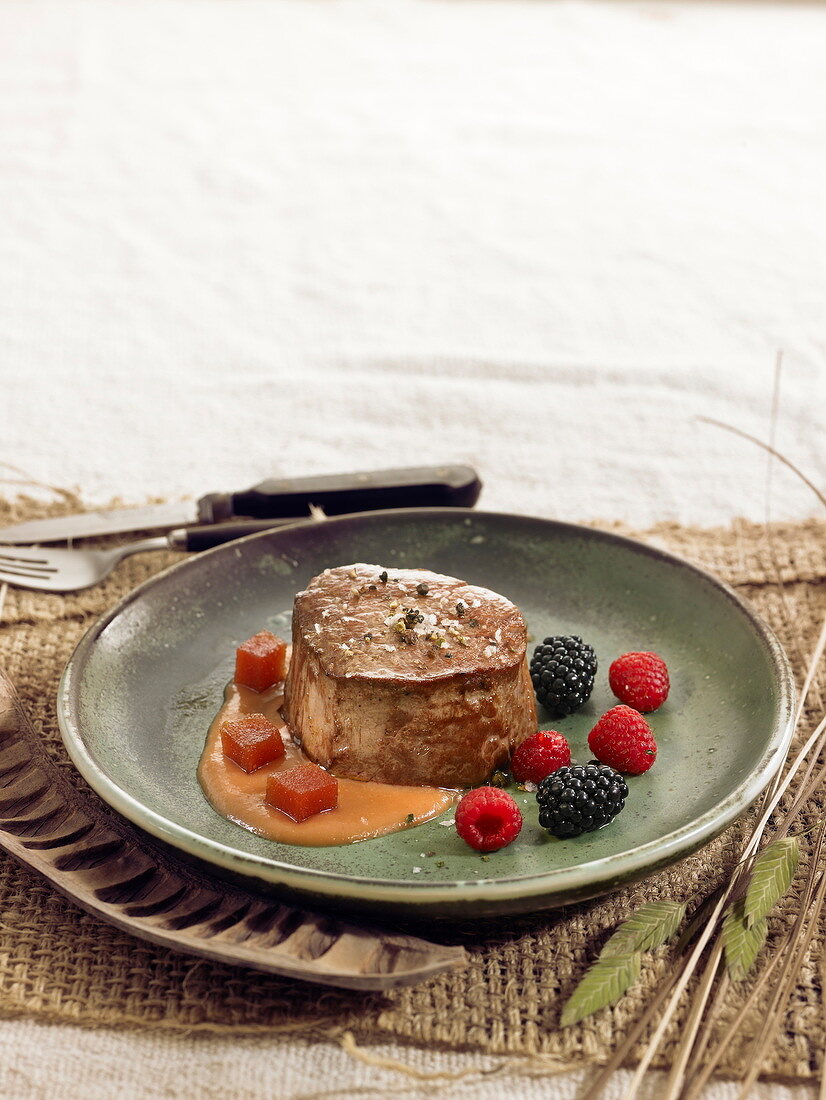 Steak with quince sauce and summer fruit