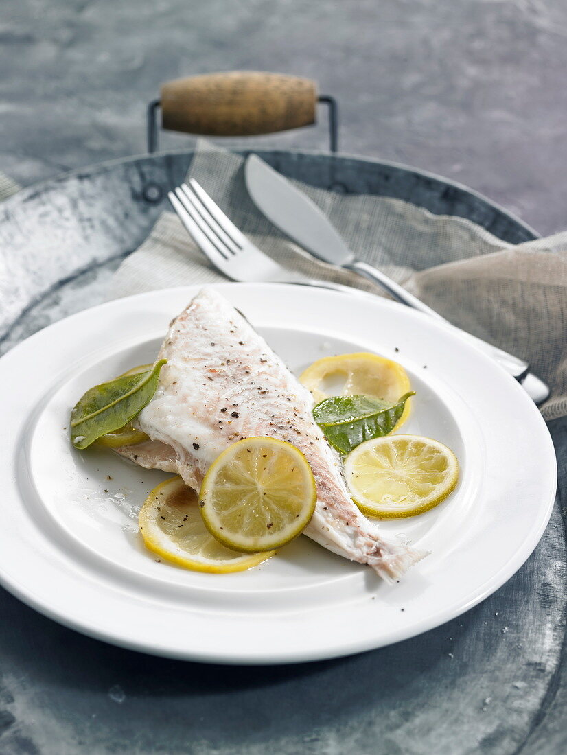 Steamed sea bream with lemons and limes