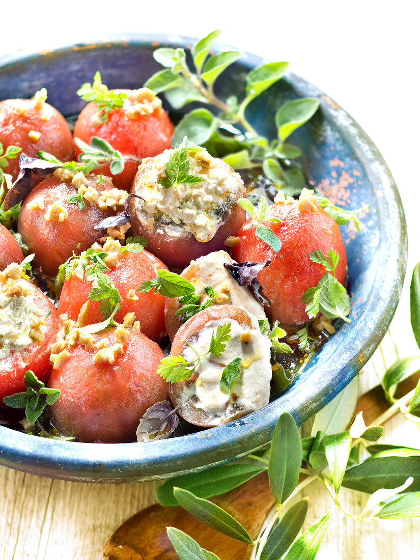 Tomatoes stuffed with fromage frais, chopped olives and herbs