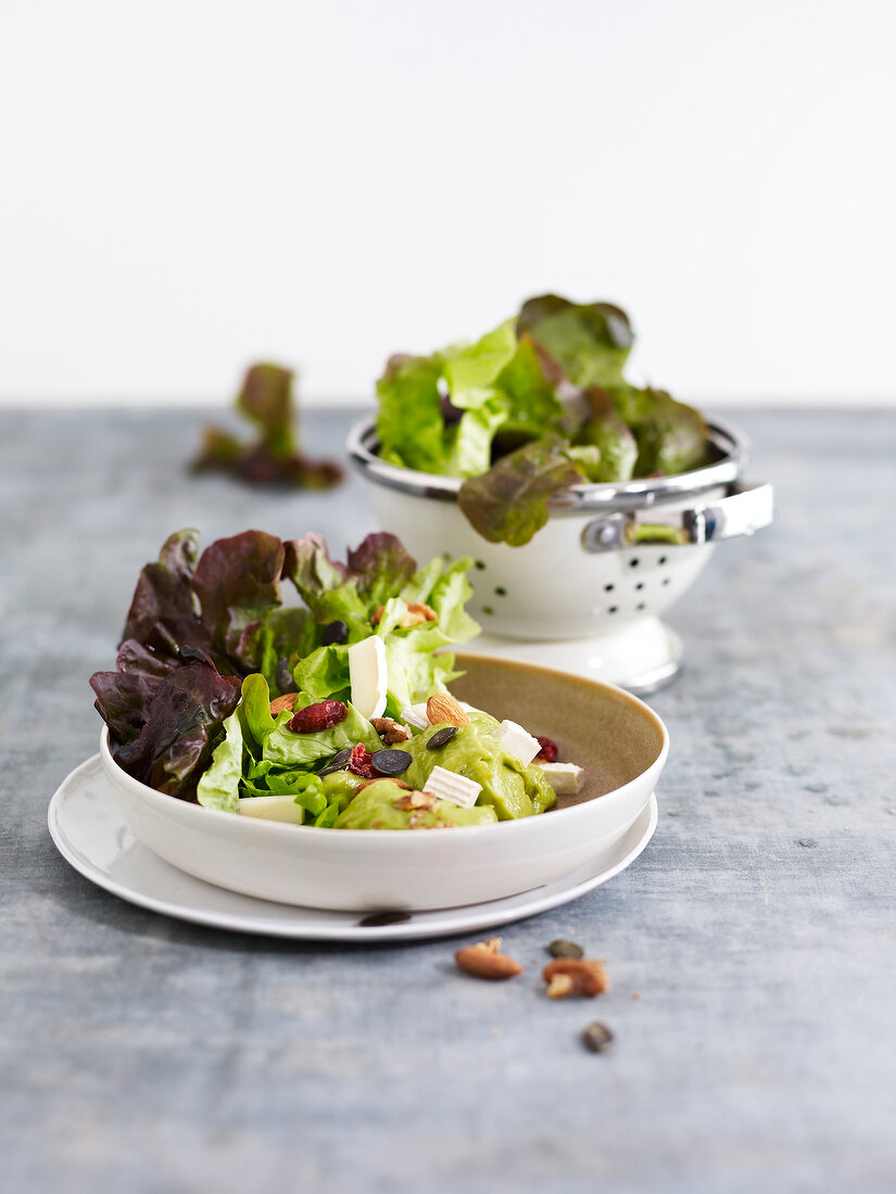 Lettuce and dried fruit salad with creamy avocado dressing