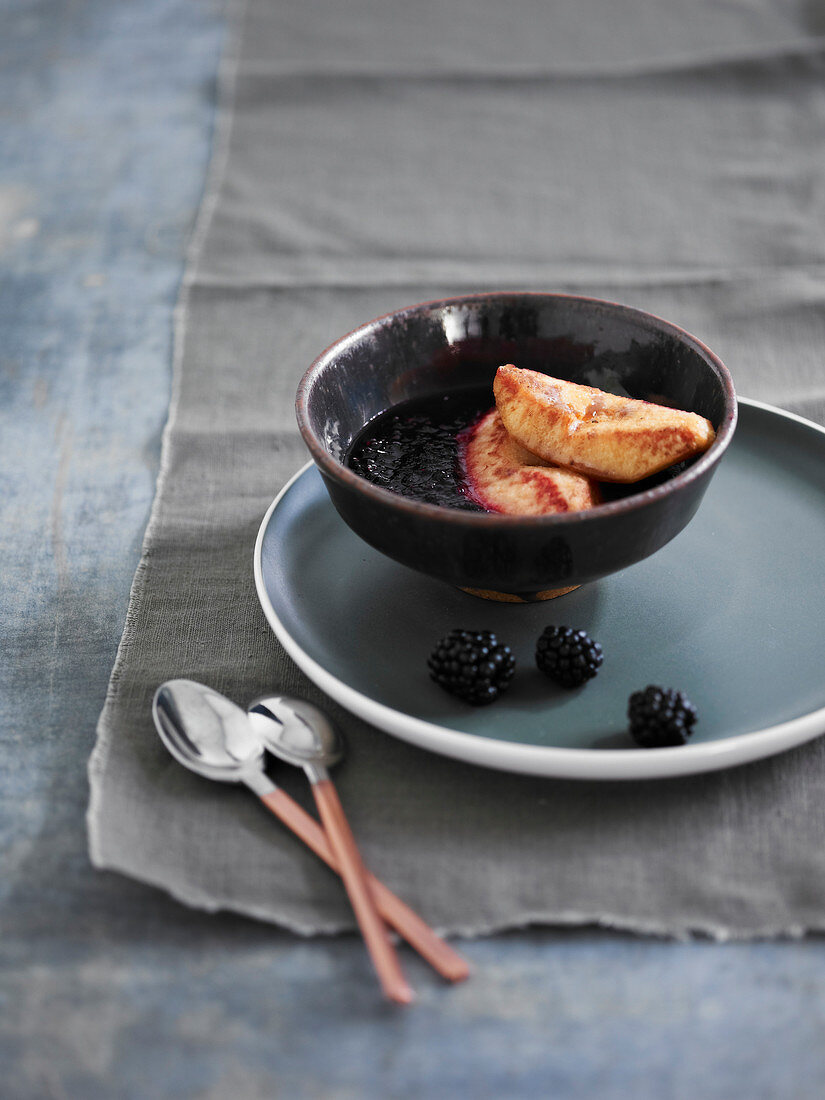 Roasted quince with blackberry coulis