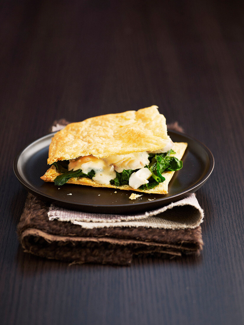 Fish and spinach flaky pastry dish