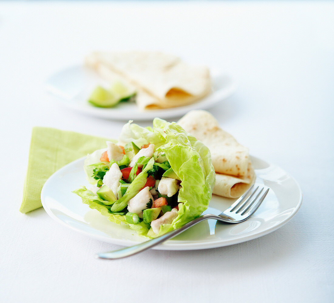 Mixed chicken salad in a lettuce leaf