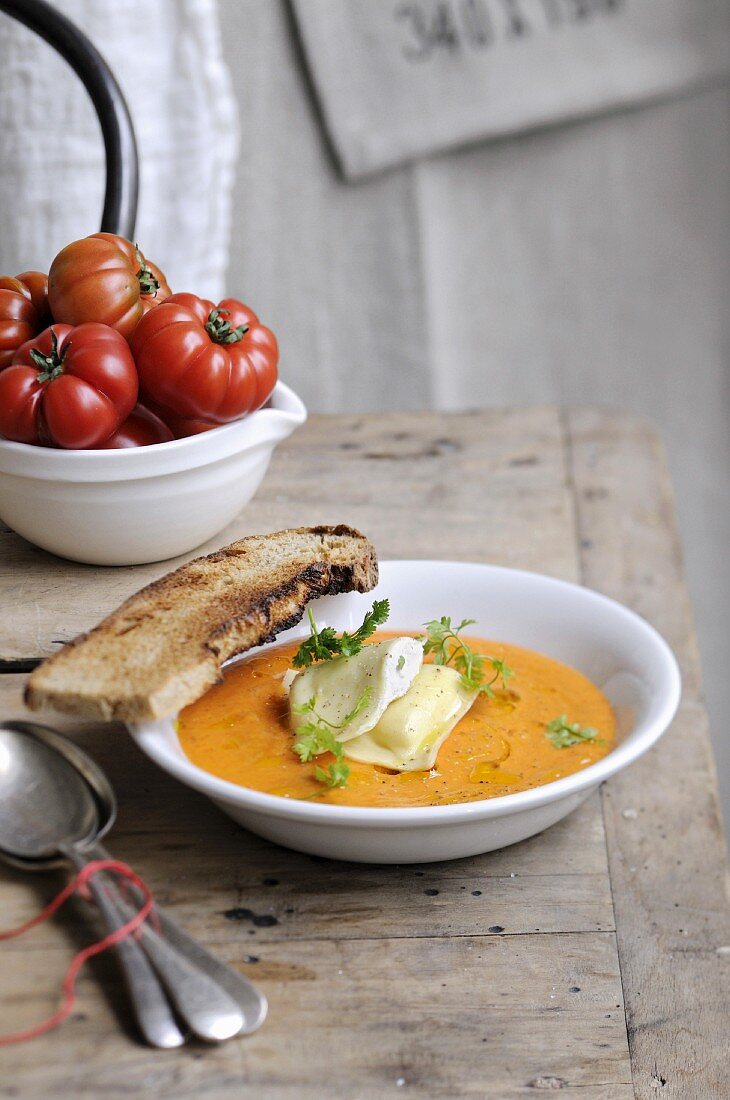 Cold tomato soup with fromage frais raviolis and