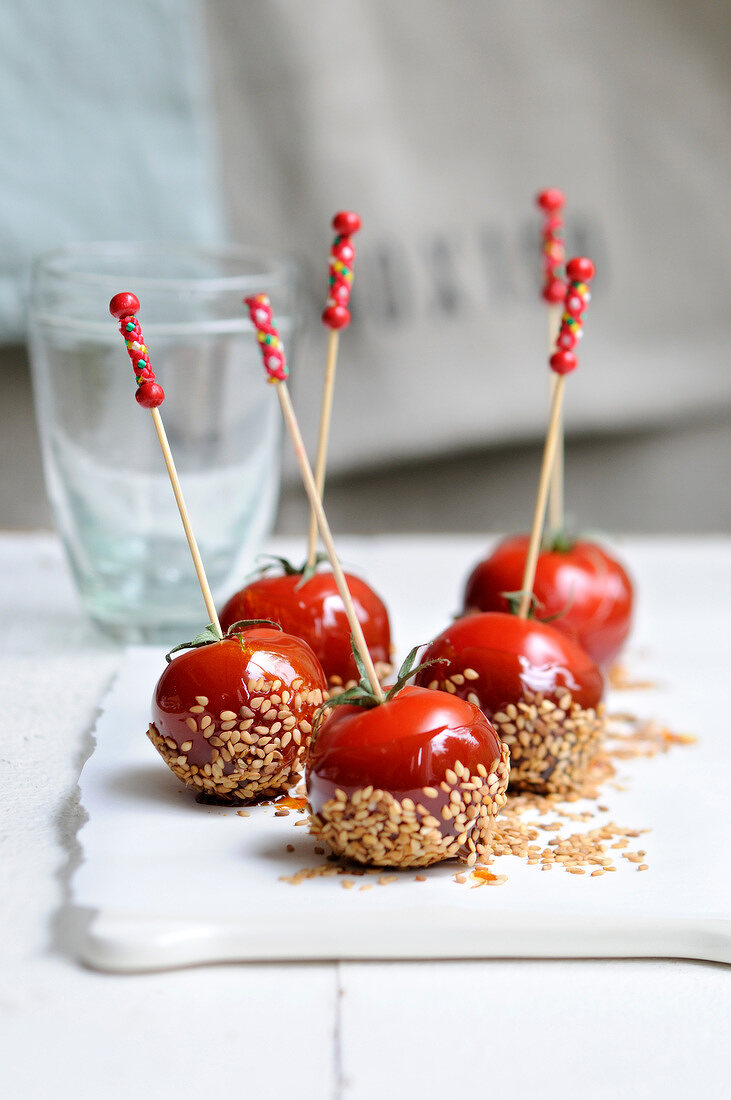 Toffee apple-style tomato and sesame seed cocktail bites