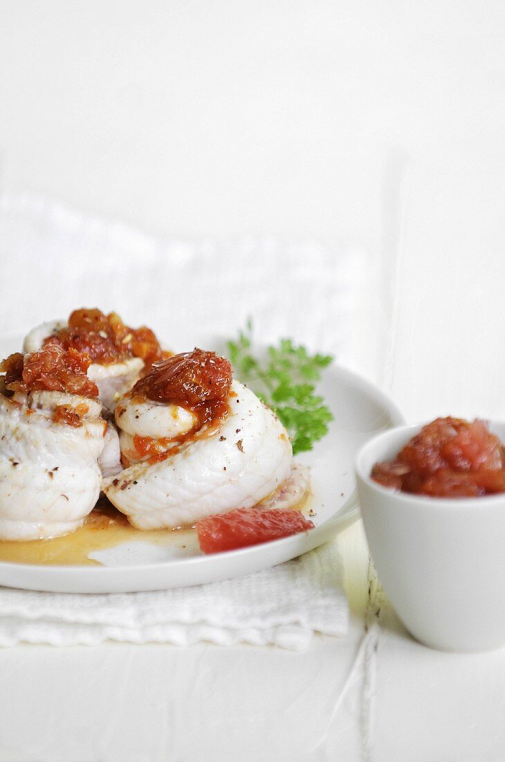 Rolled monkfish fillets with onion and grapefruit chutney