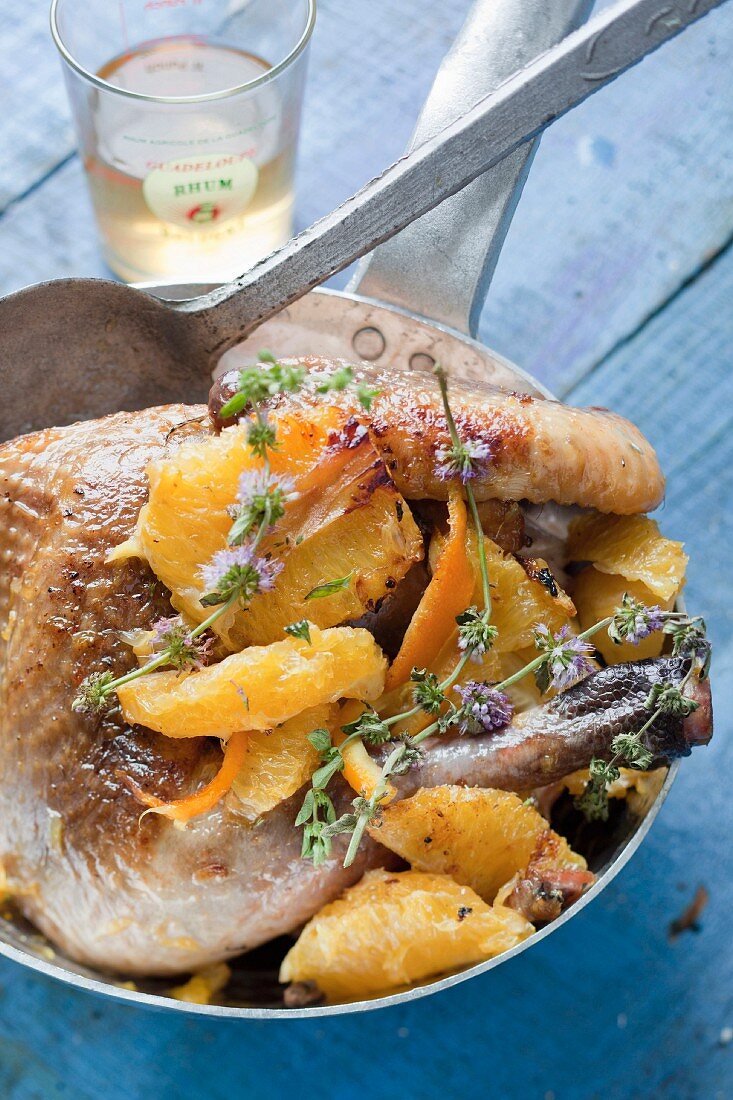 Roast guinea fowl with orange and rum