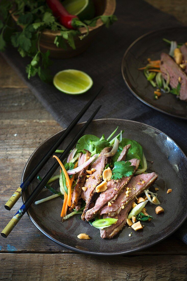 Spinach, duck and peanut salad