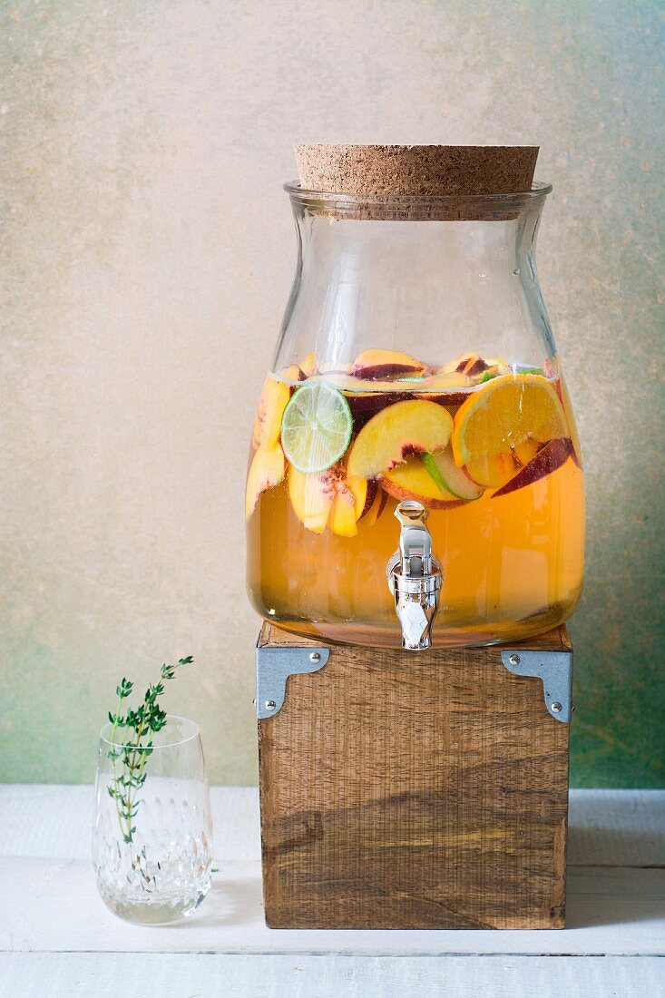 Large jug of peach and thyme Sangria