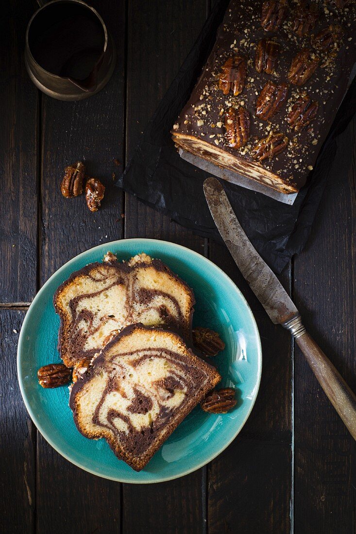 Chocolate marble cake topped with caramelised pecan nuts
