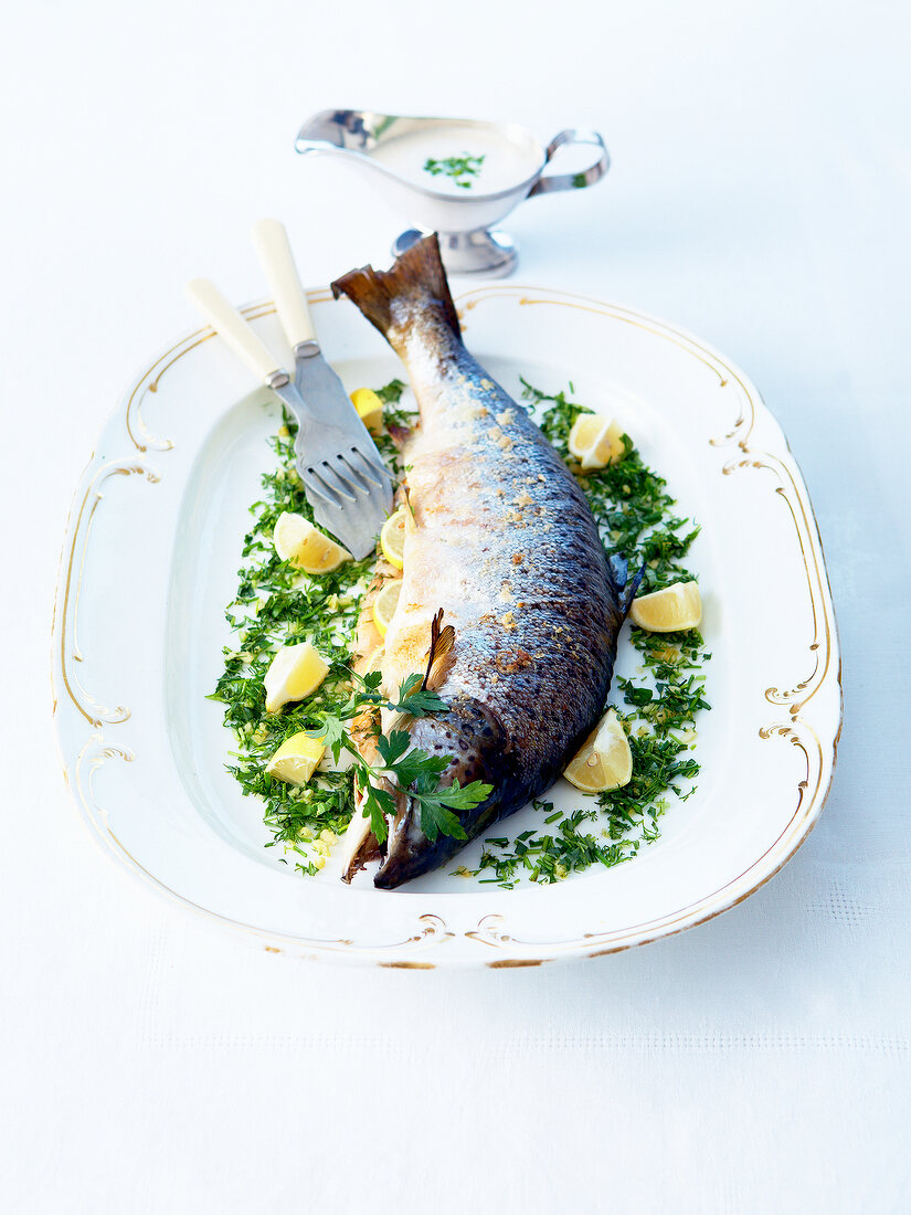 Oven-baked Adriatic salmon stuffed with lemon and herbs