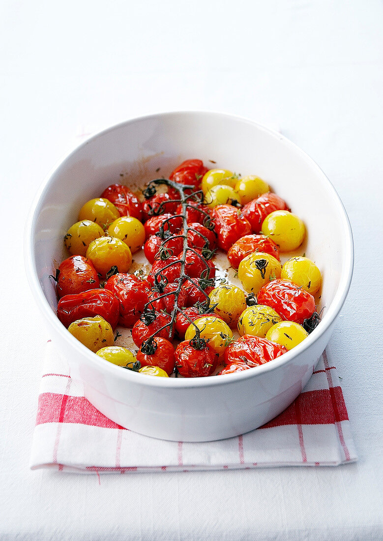 Yellow and red stewed cherry tomatoes with thyme