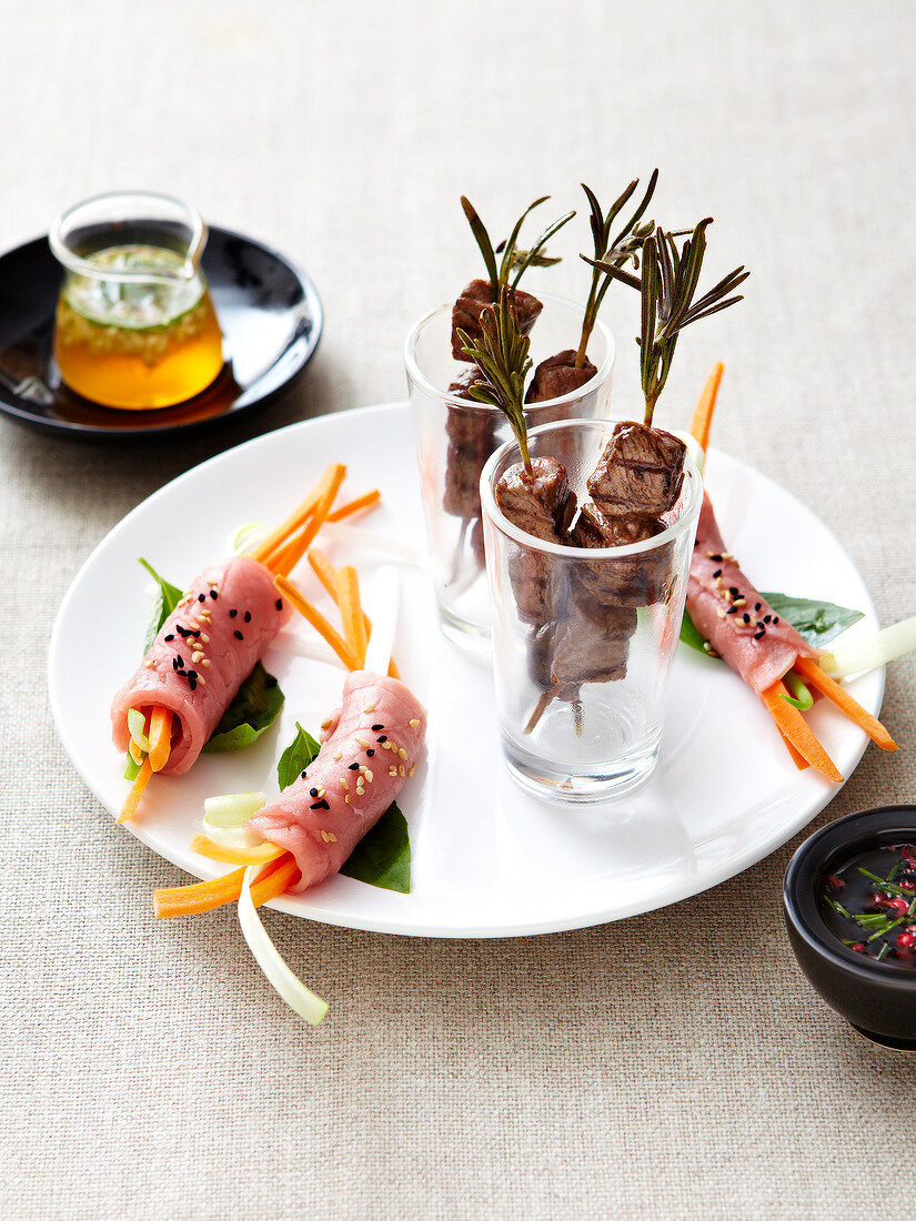 Beef duo :mini beef brochettes and raw beef and vegetable rolls