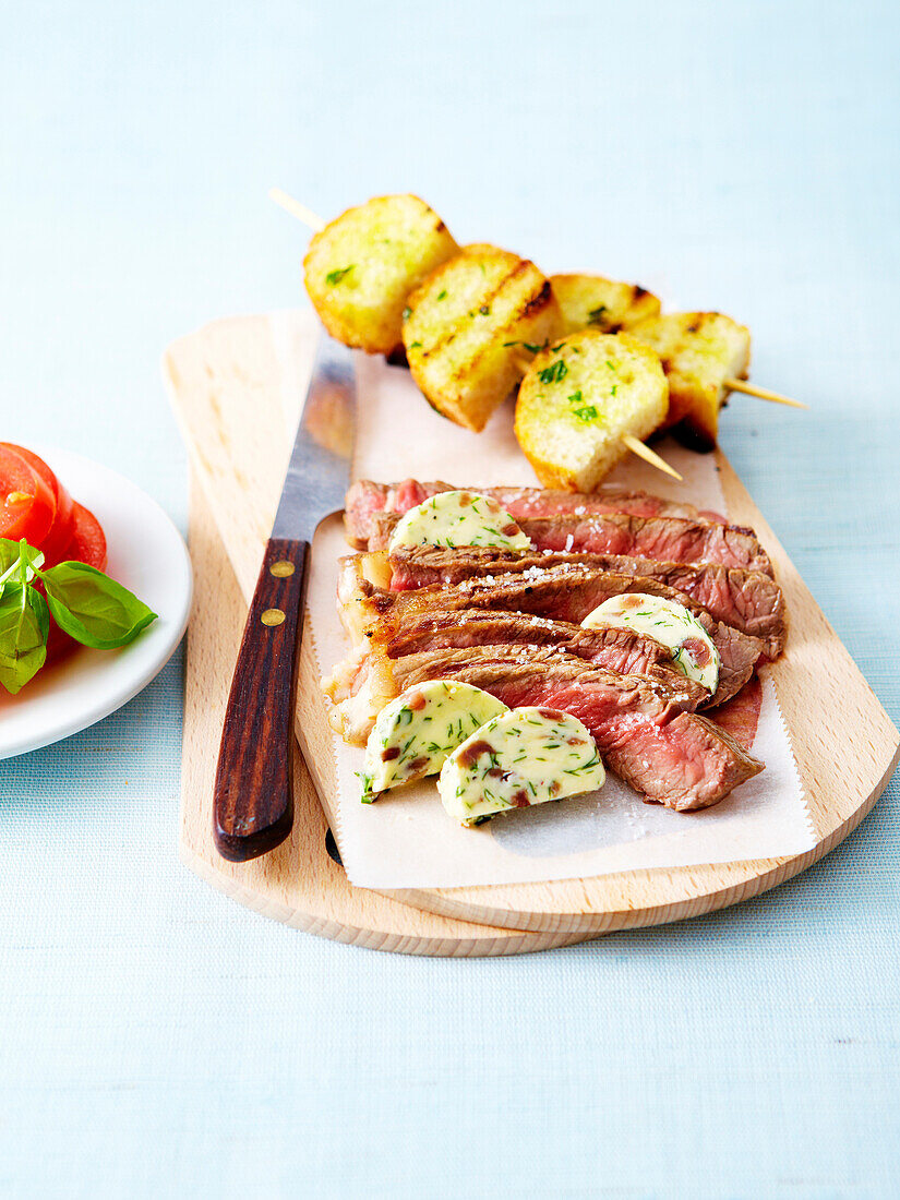 Grilled Irish sirloin ,anchovy butter and potato brochettes