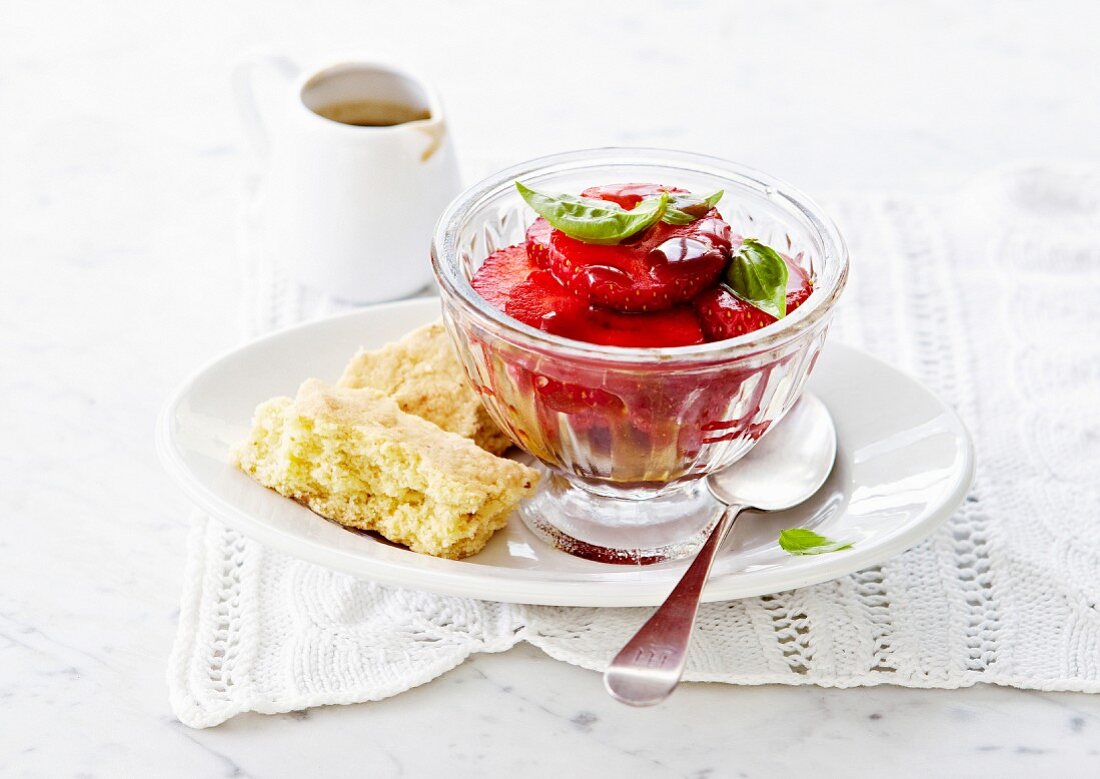 Strawberry fruit salad with basil and crispy biscuits