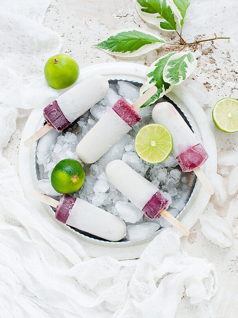 Lime and blackberry ice creams on sticks
