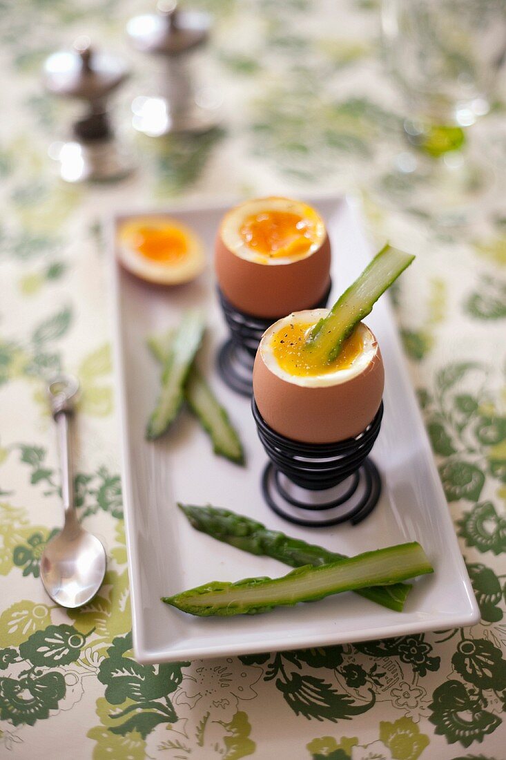 Soft-boiled eggs with green asparagus