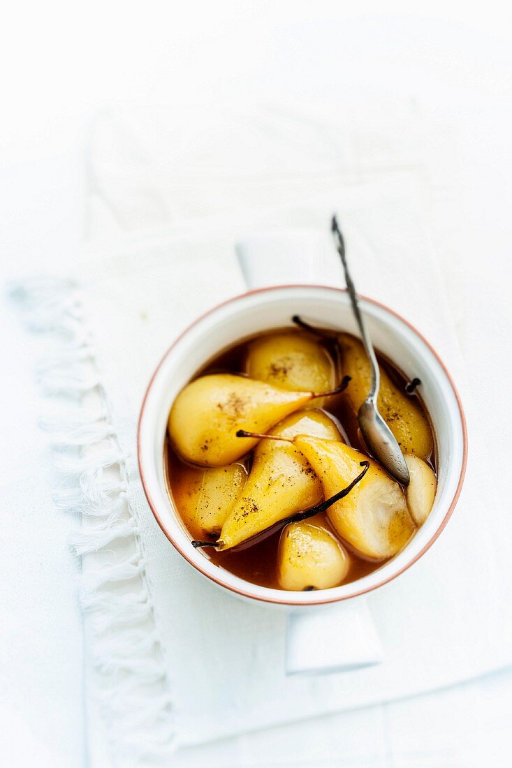 Pears poached in vanilla-flavored white wine