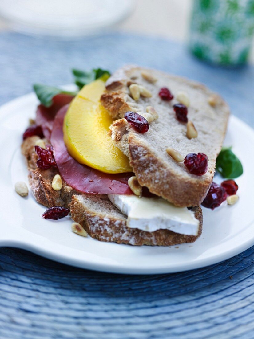 brie de Meaux,mango,bresaola,cranberry and pine nut sandwich