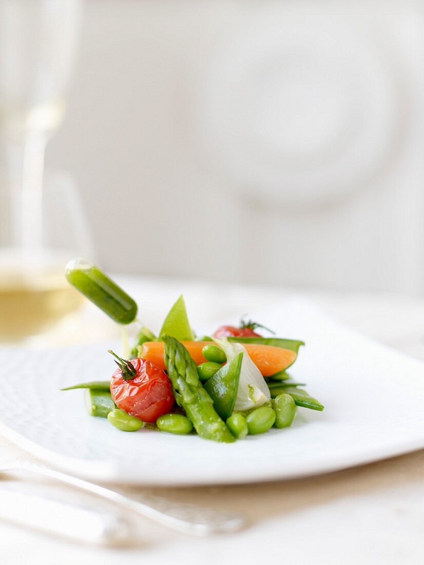 Spring vegetables and a pipette of herb sauce