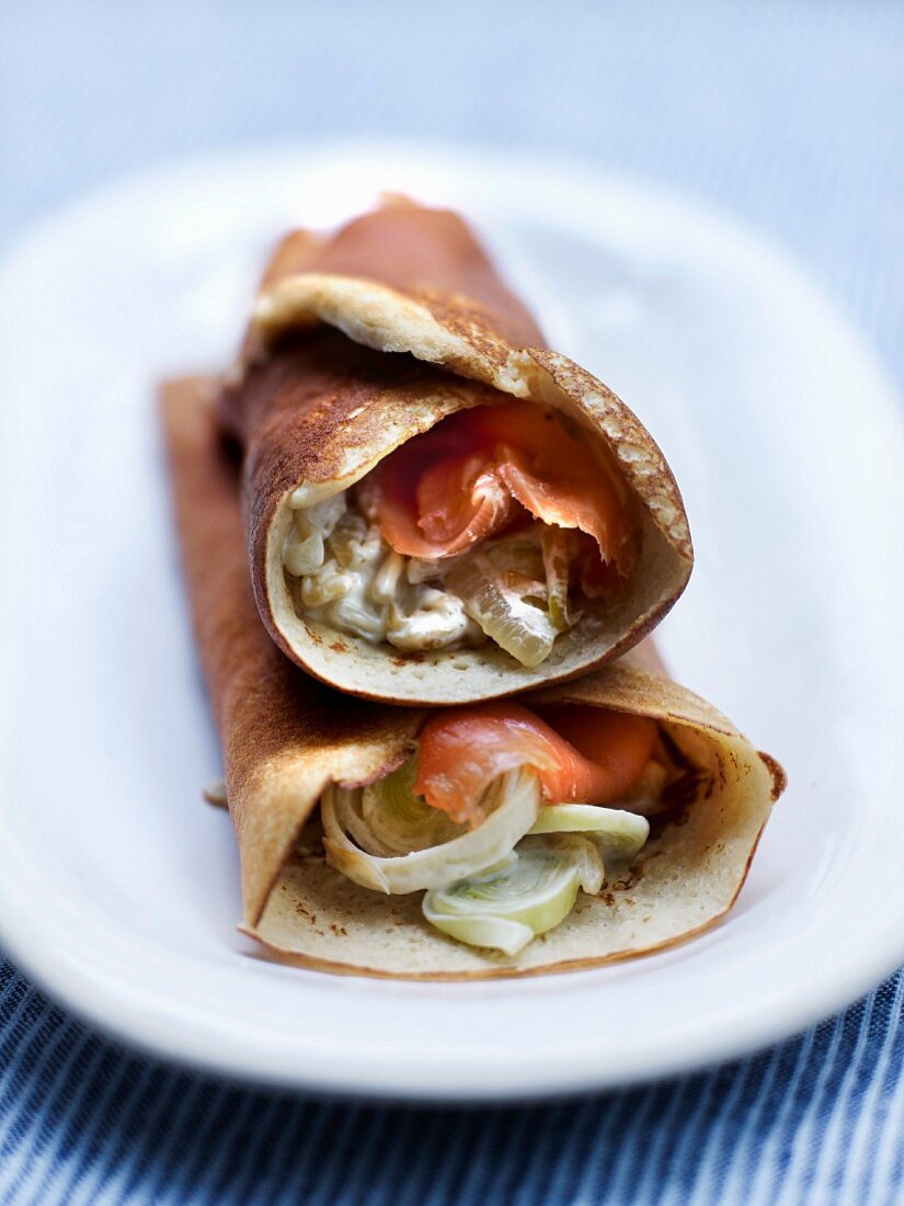 Quinoa galette cones garnished with leek fondue and salmon