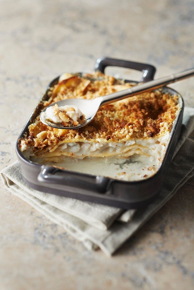 Cod and Camembert lasagnes topped with pine nut crumble