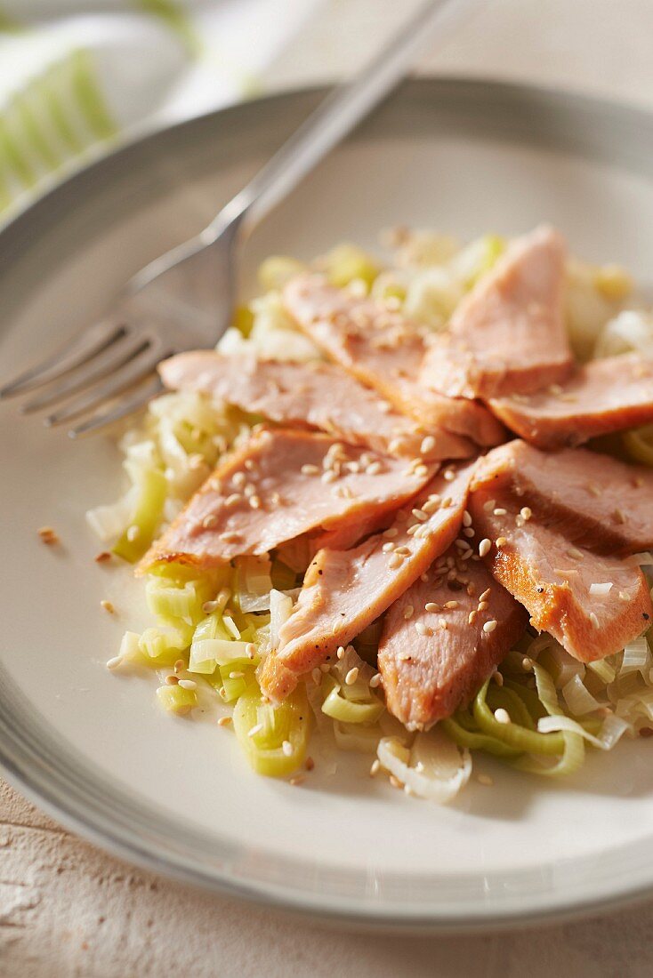 Salmon pan-fried in sesame seed oil, leeks simmered with ginger