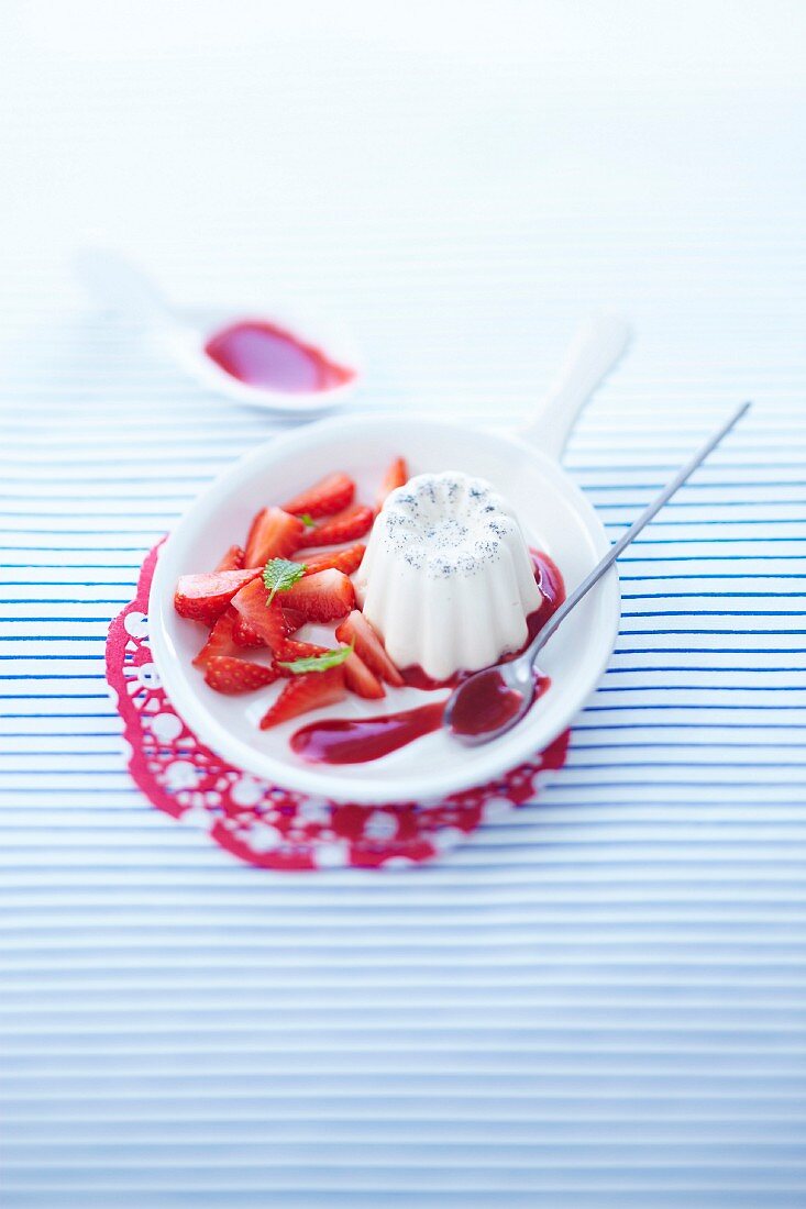 Cannelé-style vanilla panna cotta with strawberry coulis
