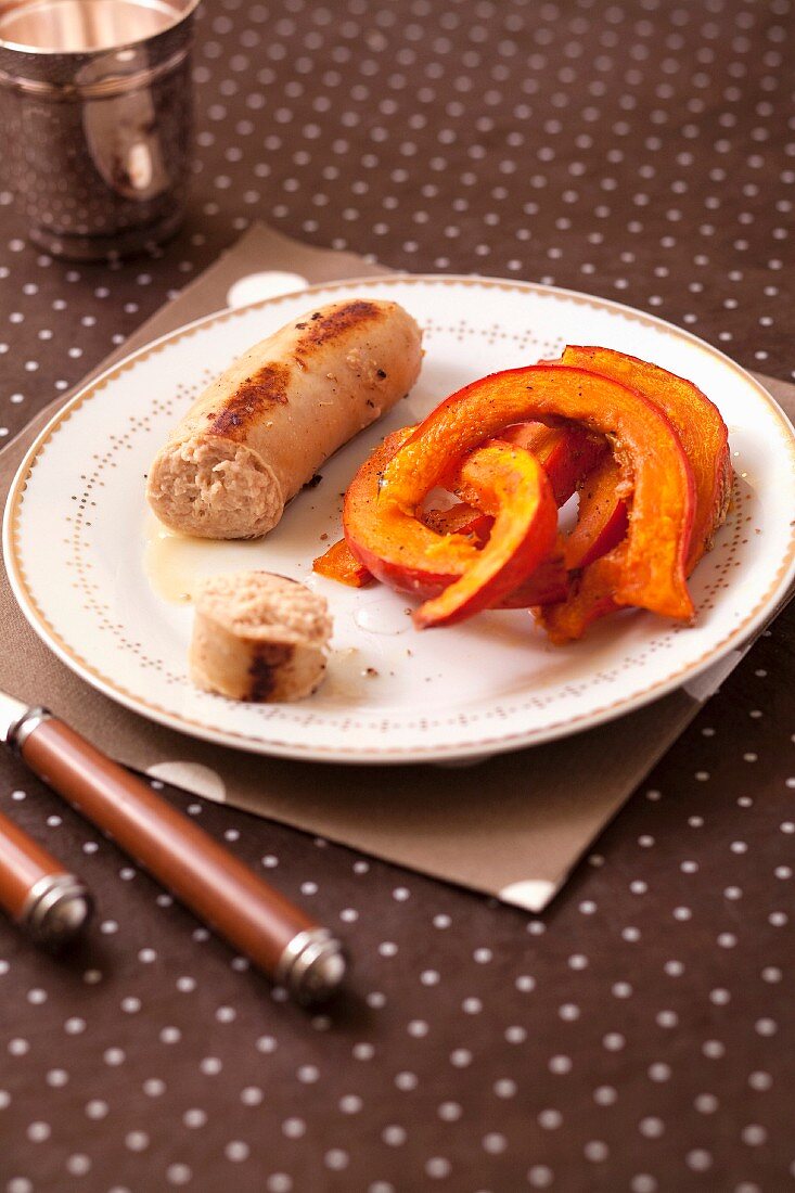 Grilled white sausage and roasted pumpkin