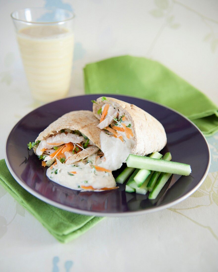 Creamy chicken and carrot pita sandwich,cucumber sticks