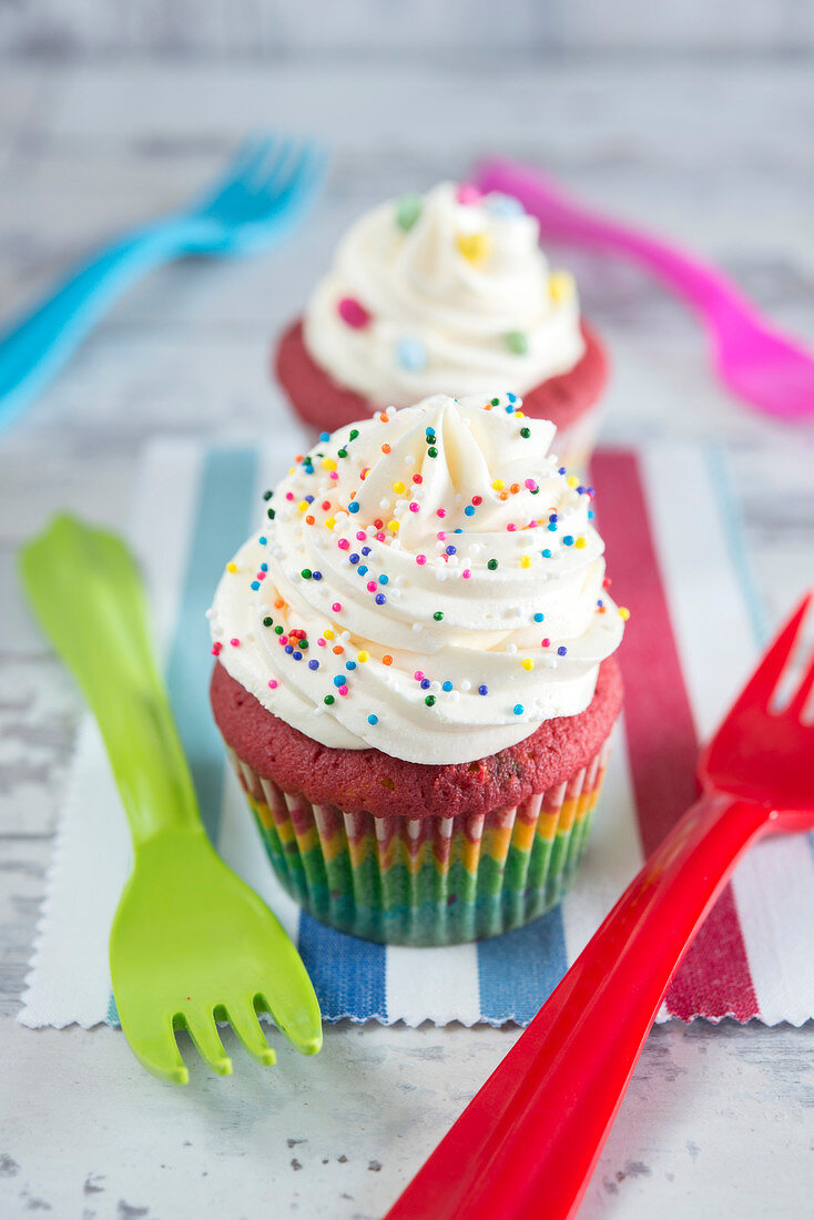 Cupcake sprinkled with multicolored sugar droplets