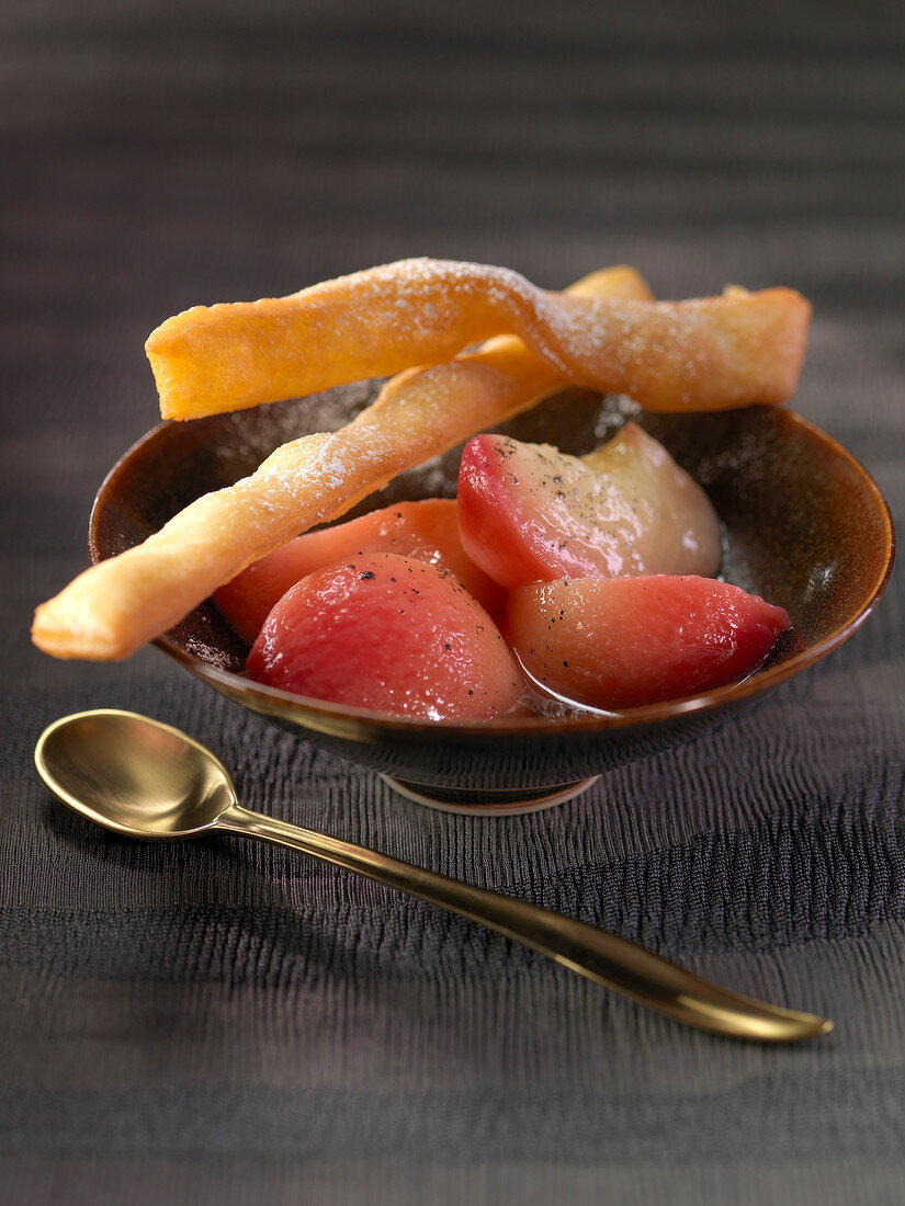 Vanilla-flavored stewed peaches and Bugnes