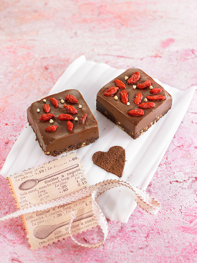 Small cakes with cocoa, buckwheat flour, dates, nuts and goji berries