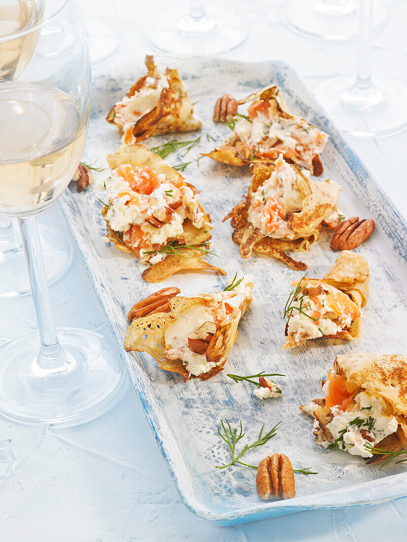 Crepes with cream cheese and smoked salmon (canapés)