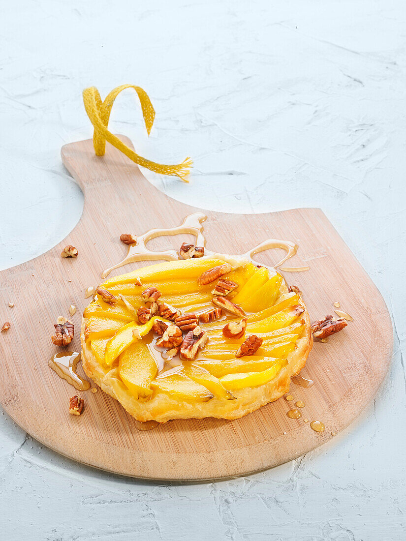 Mango and pecan tatin tartlet