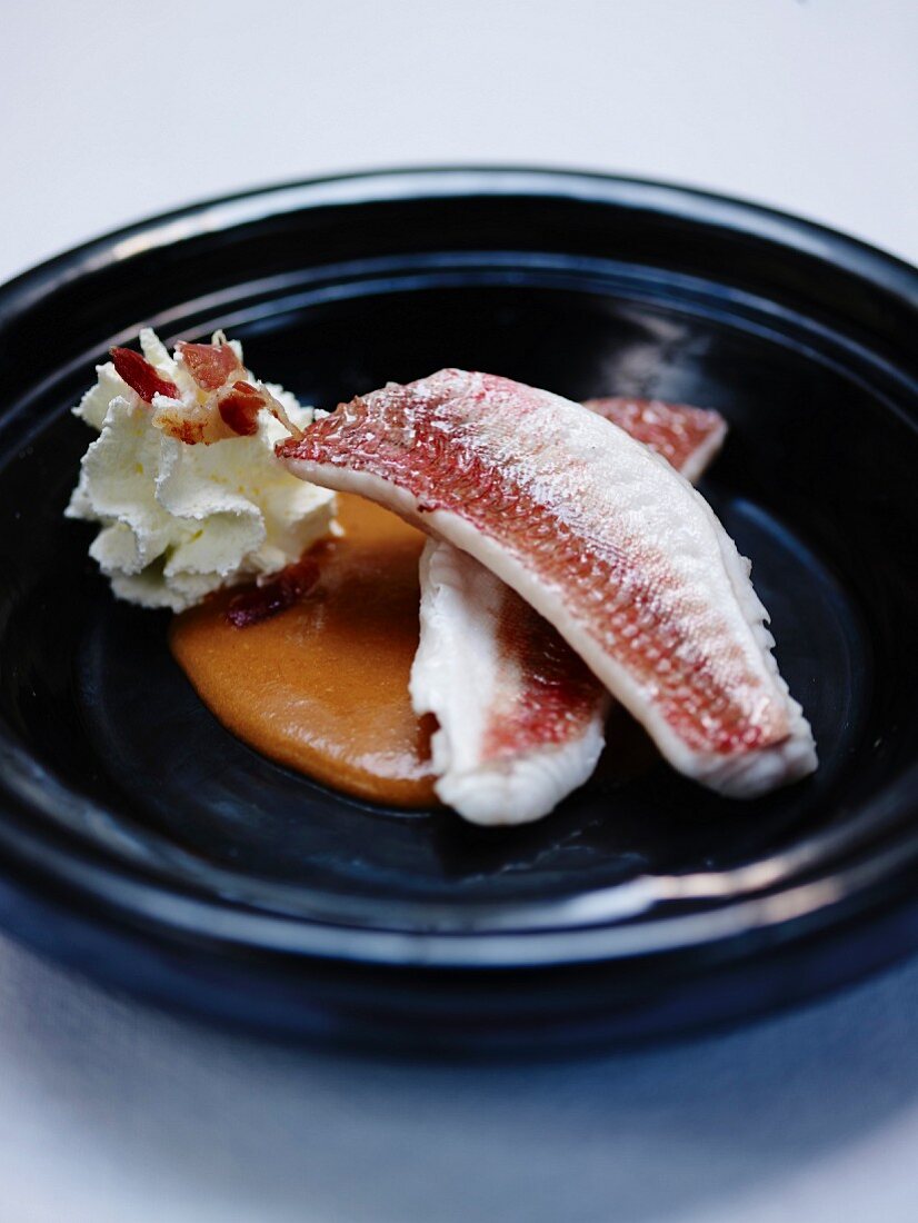 Red mullet-gurnard fillets,fish soup and whipped cream with smoked bacon