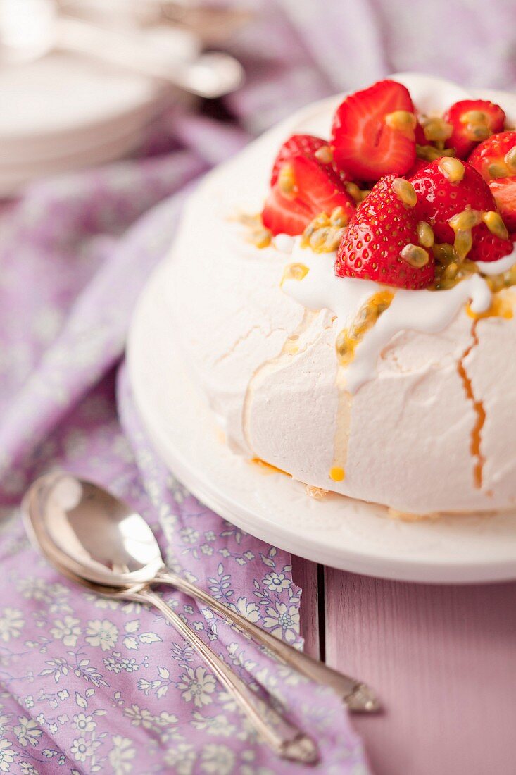 Pavlova with strawberries and passion fruit