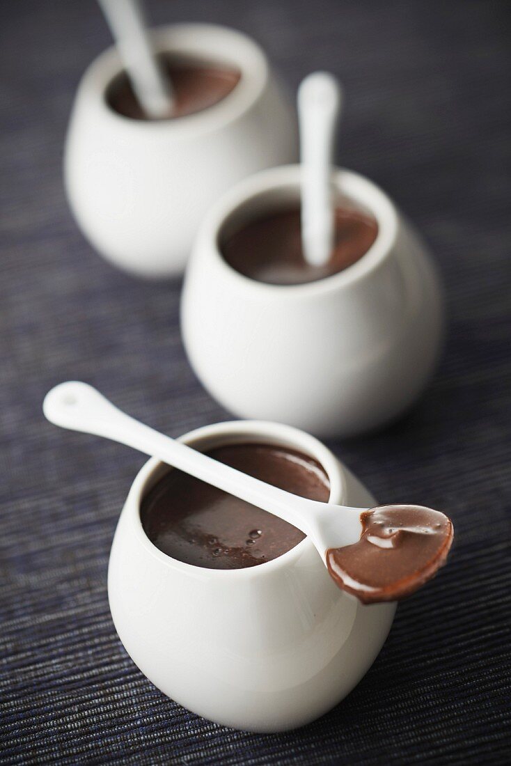 Small pots of chocolate cream desserts