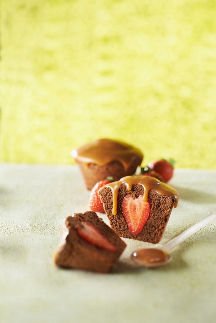Small chocolate pudding with strawberry canter and toffee sauce