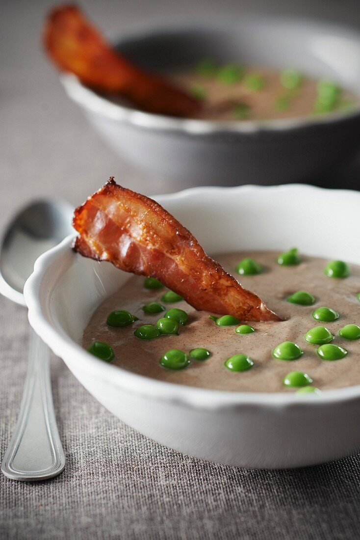 Creamed buckwheat soup with crispy bacon and peas