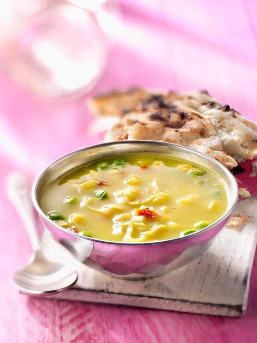Indian soup with cheese nan