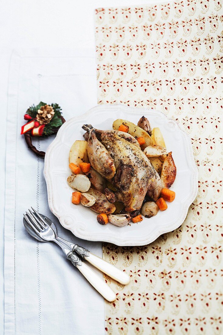 Capon with garlic and winter vegetables