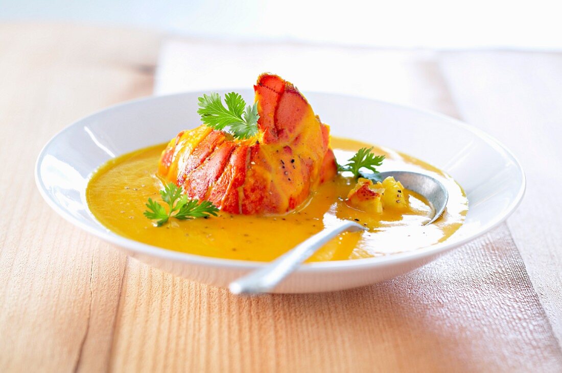 Cream of pumpkin and lobster soup