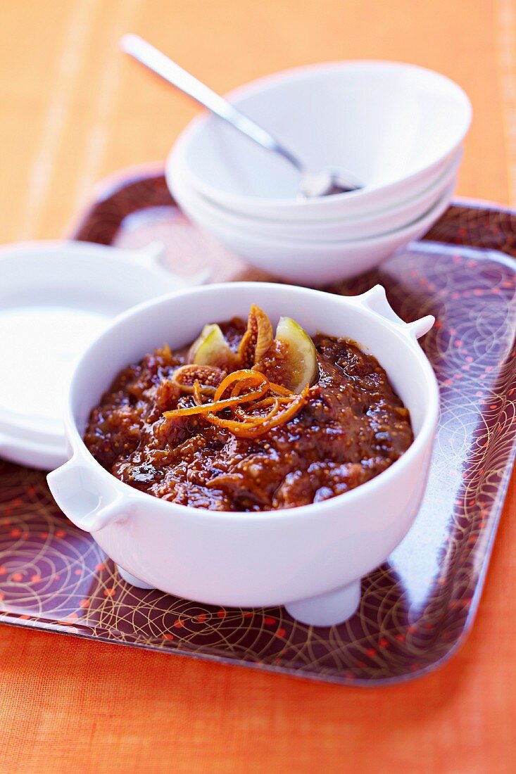 Two varieties of stewed figs with orange zests