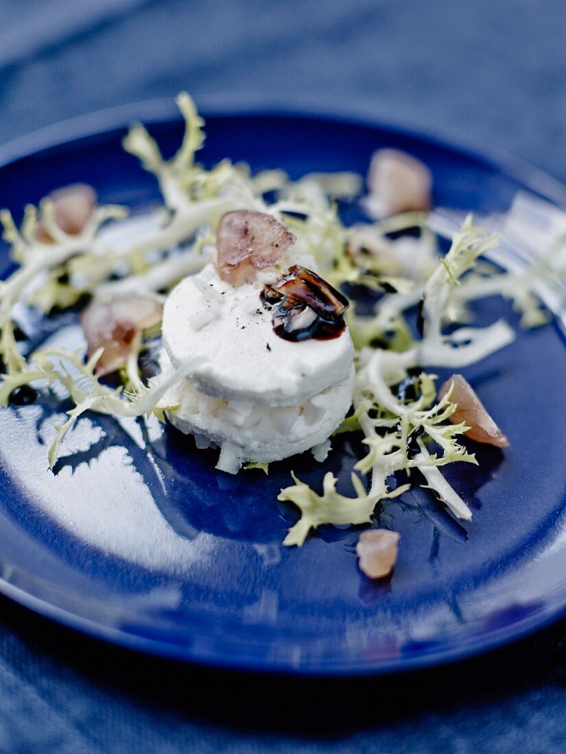 Goat's cheese garnished with black radish,candied chestnut crumbs