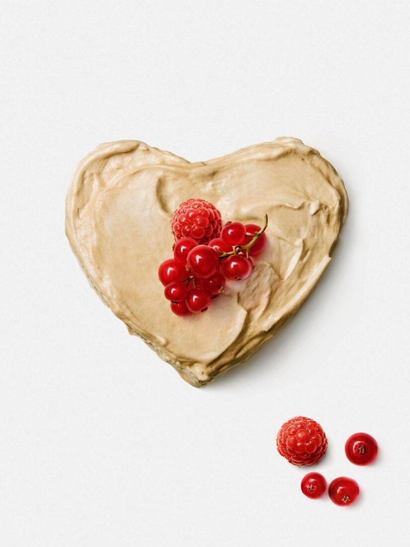 Peanut butter heart topped with summer fruit